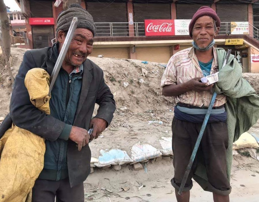 Two men with vegan meals, Kathmandu